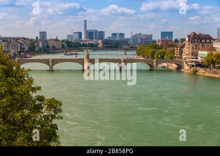 Nice view of the Rhine river with the Middle Rhine Bridge and the industrial area in the background. The bridge connects the main section of Basel... Stock Photo