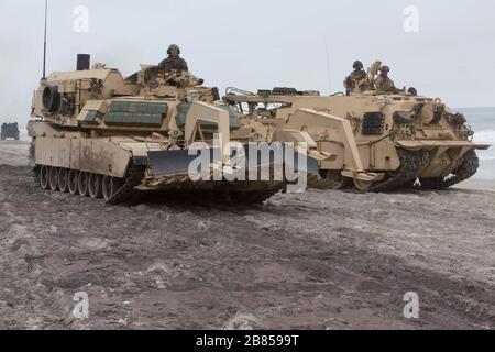 Two M1150 Assault Breacher Vehicles maneuver on Camp Lejeune, N.C., Mar. 17, 2020, during Type Commander Amphibious Training. The purpose of TCAT is for the 24th Marine Expeditionary Unit and participating elements to exercise expeditionary command and control and rehearse amphibious operations. The ABVs are with 2nd Combat Engineer Battalion, 2nd Marine Division. (U.S. Marine Corps photo by Staff Sgt. Mark E Morrow Jr/Released) Stock Photo