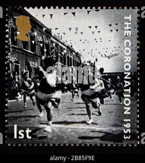 Postage stamp. Great Britain. Queen Elizabeth II. 50th Anniversary of Coronation. Children's Race at East End Street Party. 1st. 2003. Stock Photo