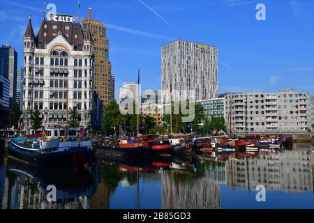 View of the city of Rotterdam The Netherlands taken from the water of the Oude Haven with the White House in the background and lots of sailing boats Stock Photo