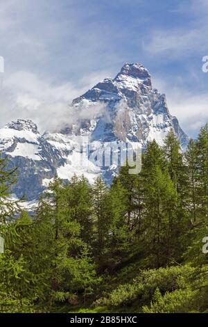 The Matterhorn viewed from Italy.  The 4,478 meter high mountain (14,692 feet) straddles the Swiss and Italian border. Stock Photo