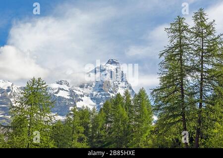 The Matterhorn viewed from Italy.  The 4,478 meter high mountain (14,692 feet) straddles the Swiss and Italian border. Stock Photo