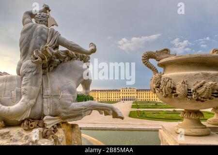 Schönbrunn  Palace with the Neptune Fountain in the foreground Stock Photo