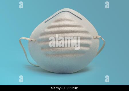 Protective face mask white on blue background Stock Photo