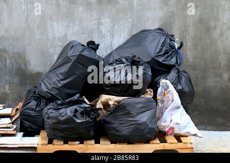 pile of waste garbage plastic black and trash bag stack waste many Stock Photo