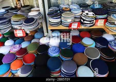 Colorful Kippah caps displayed in a shop in the Mahane Yehuda market in Jerusalem. Stock Photo