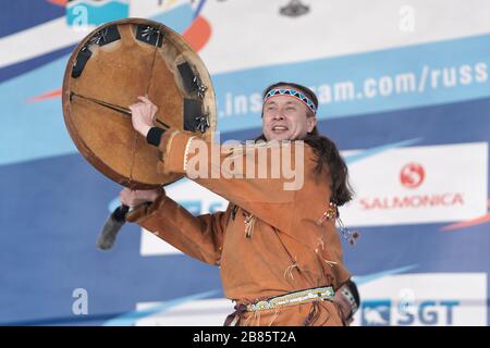 Male dancer in national clothes indigenous people emotional dancing with tambourine. Concert Koryak Dance Ensemble Mengo. Kamchatka Peninsula Stock Photo