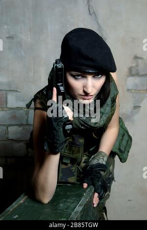 military woman with gun Stock Photo
