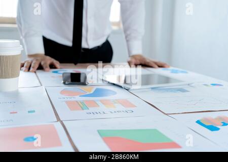 Businessmen are planning marketing. By documenting the analysis table to be placed on the desk to check for disadvantages, solutions Stock Photo