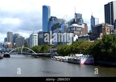 Central Melbourne and high rise buildings on the banks of the River Yarra Stock Photo