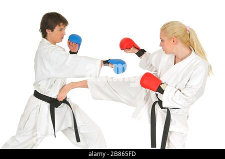 Young karate trainer and student in combat gloves and kimono and trains getting ready for the studio championship on a white background. Martial arts Stock Photo