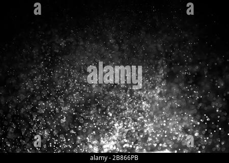 Texture background abstract black and white or silver Glitter and elegant for Christmas. Dust white. Sparkling magical dust particles. Magic concept. Stock Photo