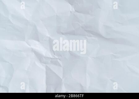 Background concept. The white paper that looks like a crumpled into a pattern. Stock Photo