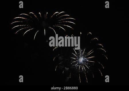 Festive fireworks. Realistic colorful firework on black background. Multicolored explosion. Christmas or New Year greeting card. Venice Stock Photo