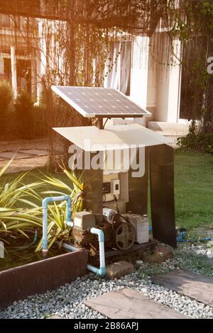 Pumping water to cultivated plots using solar panels. Stock Photo