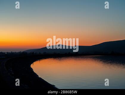 Crooks Peak taken from Cheddar Reservoir. The reservoir in Somerset, England, operated by Bristol Water. Stock Photo