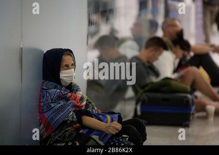 Mexico City, Mexico. 19th Mar, 2020. A passenger wearing a face mask is seen at the airport in Mexico City, Mexico, March 19, 2020. Credit: Francisco Canedo/Xinhua/Alamy Live News Stock Photo