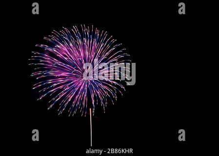 Beautiful colorful fireworks sparkle in night sky Stock Photo
