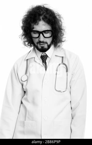 Studio shot of tired man doctor looking down Stock Photo