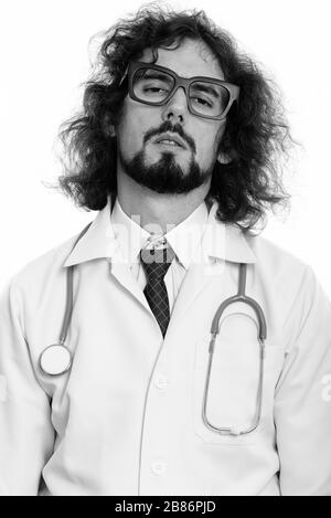 Studio shot of man doctor looking tired Stock Photo