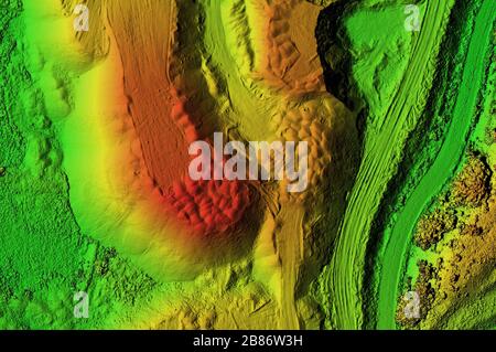 DEM - digital elevation model. Product made after proccesing pictures taken from a drone. It shows excavation site with piles of aggregates Stock Photo