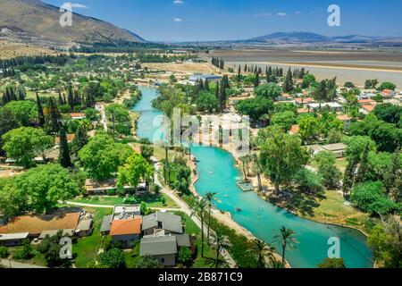 Turquoise water of the river flowing through Nir David kibbutz in Northern Israel Stock Photo