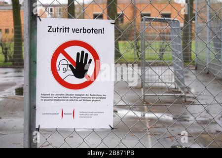 Hannover, Germany - March 20, 2020: Closed sports ground with Kein Zutritt verboten - meaning no entry in German - prohibition sign as social distancing measure during corona epidemic crisis