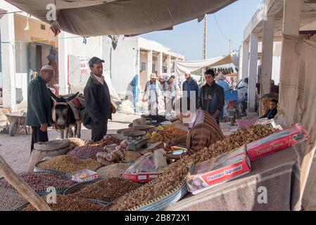 Essaouria, Morocco - September 2017: A farmers attends his stall, selling his produce at the weekly berber open market outside Essaouira in Morocco. W Stock Photo
