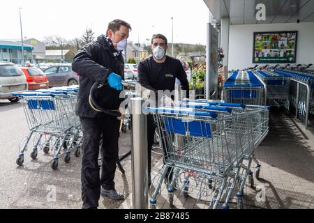 Skibbereen, West Cork, Ireland, 20th March 2020. Lidl stores are having their shopping trolleys constantly sanitised for customers.  Credit aphperspective/ Alamy Live News Stock Photo