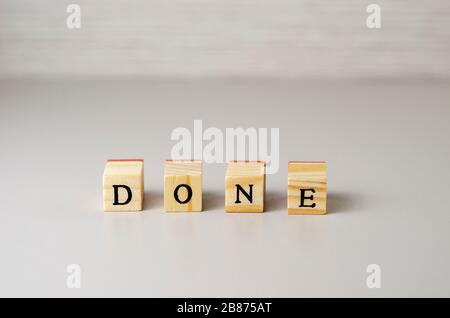 word done made of letters on wooden cubes Stock Photo