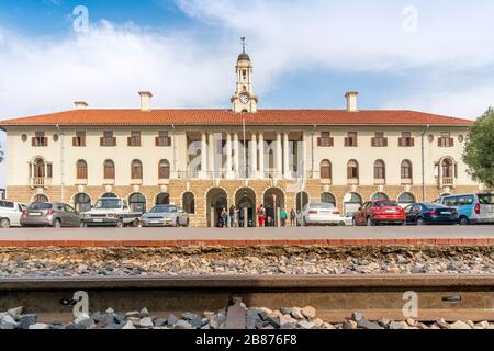 Train station building with rail trucks in the foreground, Pretoria, South Africa Stock Photo