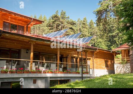 Solar panel on a red roof Stock Photo