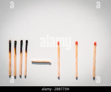 Social distancing concept showing how it can stop spreading of corona virus pandemic. Game stone concept illustrating epidemic safety. Keep the distan Stock Photo