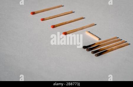 Social distancing concept showing how it can stop spreading of corona virus pandemic. Game stone concept illustrating epidemic safety. Keep the distan Stock Photo