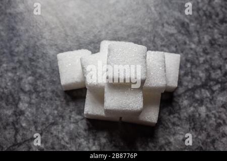 Sugar cubes stacked in a pile Stock Photo