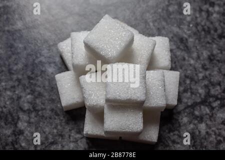 Sugar cubes stacked in a pile Stock Photo