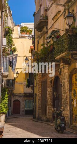 Old narrow street in historic center of Bari, italy Stock Photo