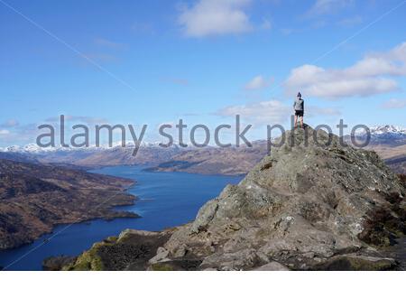 Trossachs, Scotland, UK. 20th Mar 2020. Taking in the view from the summit of Ben A'an looking down towards Loch Katrine and snow capped mountains on a clear sunny day. Credit: Craig Brown/Alamy Live News Stock Photo