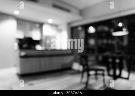 Blurred Luxurious Wooden And Clean Modern Kitchen With Glass Counter Stock Photo