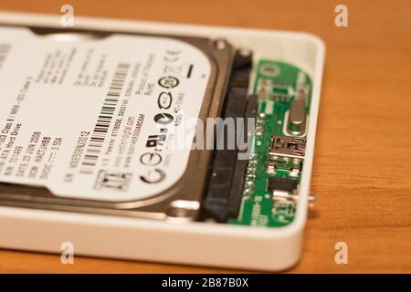close-up view of an internal hard disk of a notebook connected to an external usb box Stock Photo