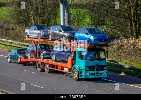 Auto transporter, car transporter carrier; Motorway heavy bulk Haulage delivery trucks, haulage, 2002 Mercedes Benz Atego lorry, transportation,  collection and deliveries, truck, special cargo, vehicle, delivery, transport, industry, freight on the M6 motorway.