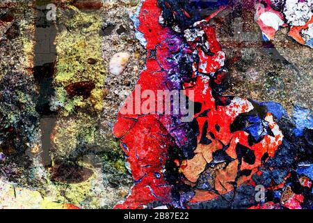 Surface texture with many colors on a concrete wall with a strong porous and cracked surface structure. For abstract backgrounds. Germany Stock Photo