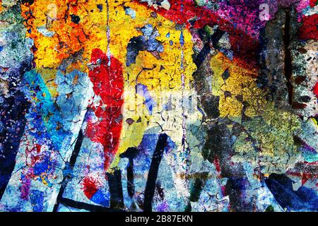 Surface texture with a lot of colors on a concrete wall with a strong porous and cracked surface structure. For abstract backgrounds. Germany Stock Photo