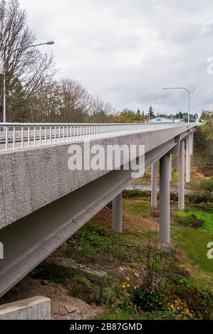 Looking down one side of the 8th Street Bridge in Port Angeles, Washington.  This image was taken in 2010, before suicide fences were  installed. Stock Photo