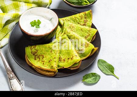 Green pancakes from spinach top view. Stock Photo