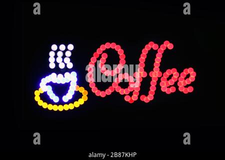 Coffee shop sign LED Bokeh light on dark background, Coffee shop sign Light signage bokeh dot colorful, Sign word coffee cup neon dot light symbol on Stock Photo