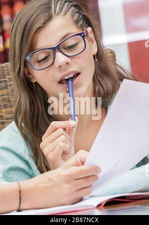 pretty student girl doing homework at home Stock Photo
