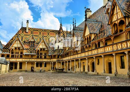 Iconic courtyard of Hotel Dieu, Beaune, France Stock Photo