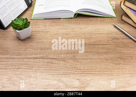 Vintage book, open, on old wooden table, with clipping path. Open Book blank on old wooden background. book with blank pages Stock Photo