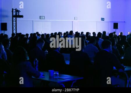 Attendees at a congres listening to the speaker Stock Photo